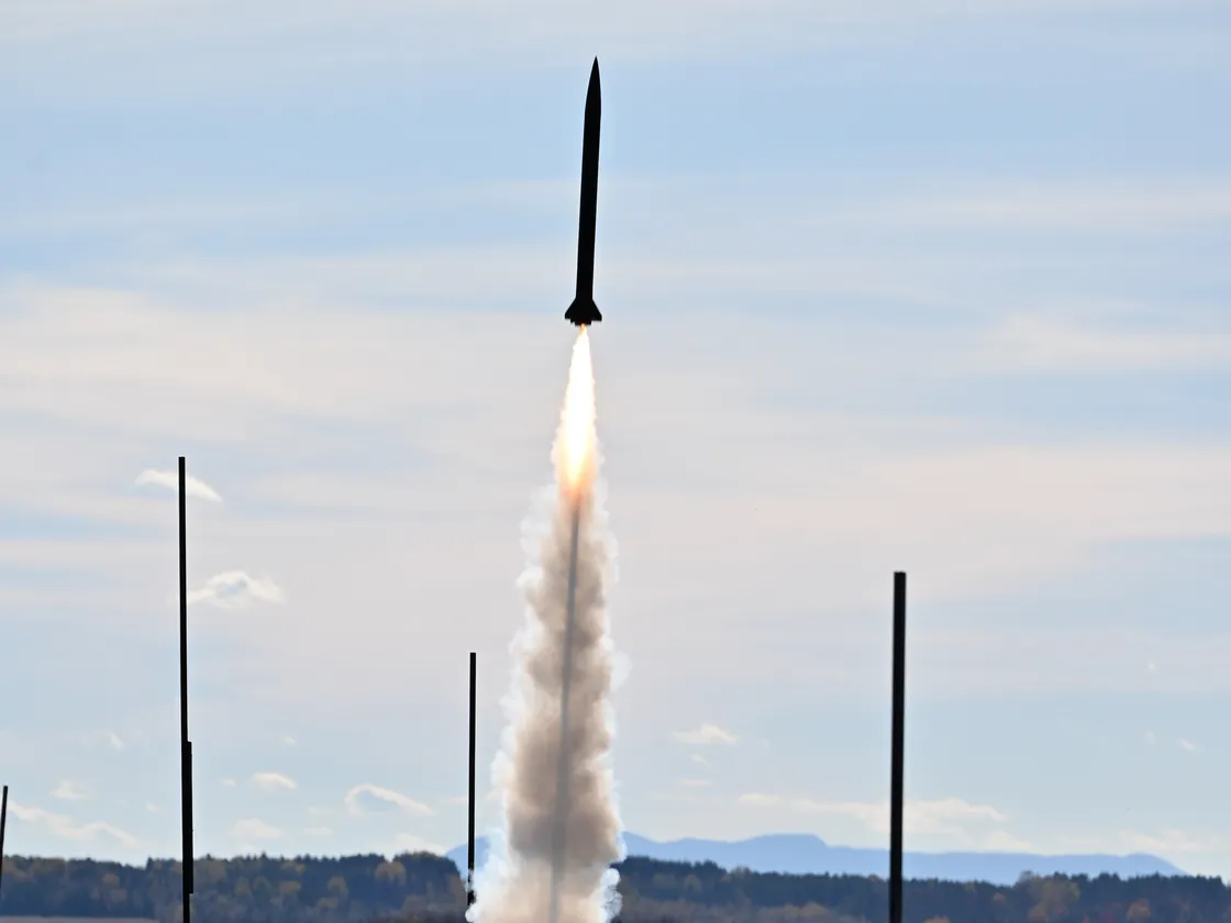 Ekaterina III launching above a field in autumn
